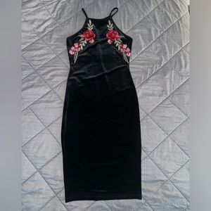 A black small dress with flowers printed never worn